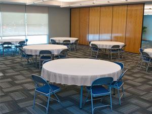Multi-purpose room with covered round tables