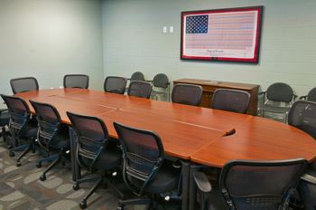 Woodmen Community Center meeting room with oval table and chairs